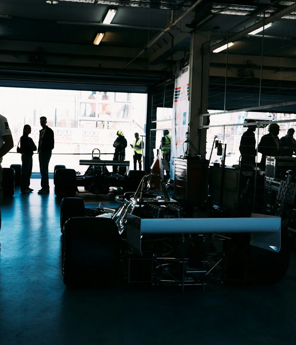 the workshop — a car in the bay, upright