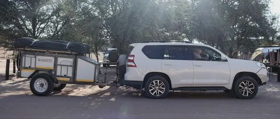 a car towing a trailer