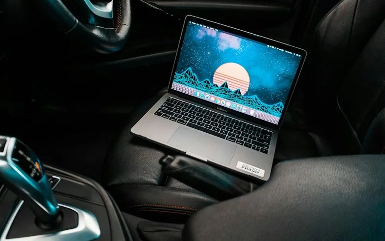 a laptop in a car — article card