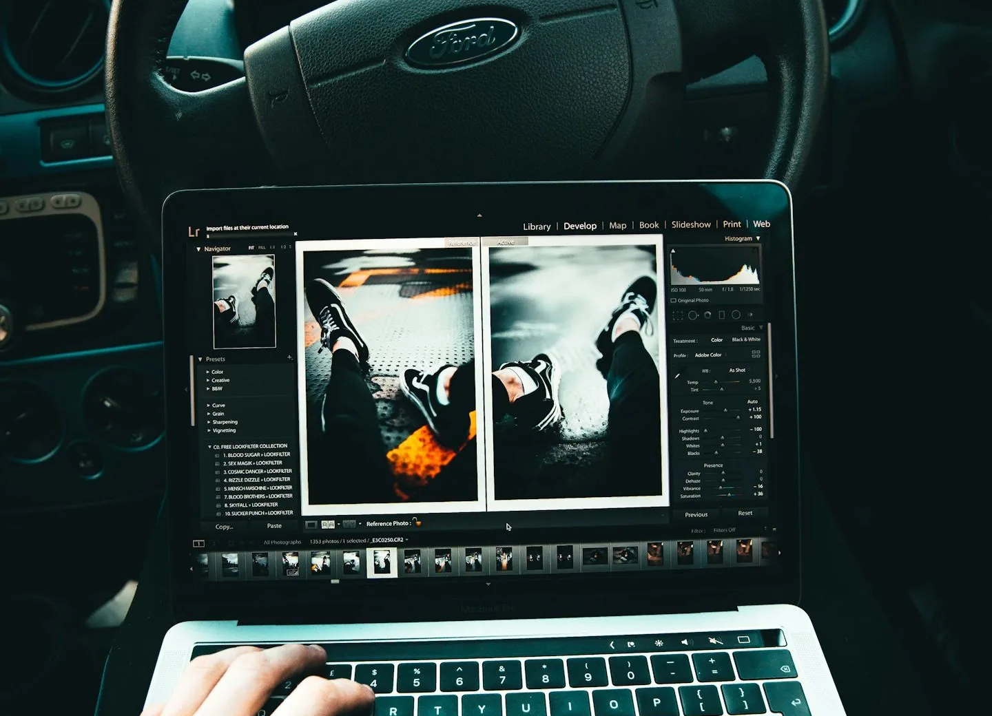 tuner's hands on a laptop in a car